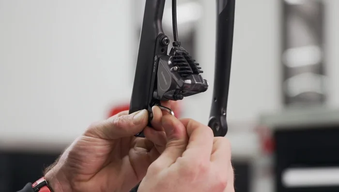 Tighten the eye bolts locking nuts using the 8mm open-end wrench.