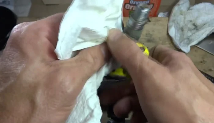 Wipe off excess grease and oil (454.25s)