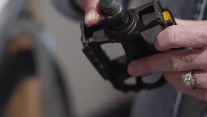 Tighten the pedals securely using the wrench. Remember the left pedal threads in backward.