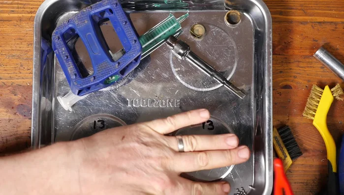 Insert the axle through the bearings.