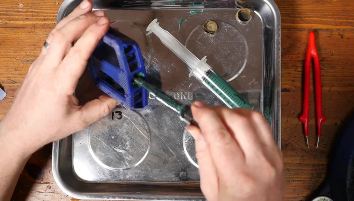 Insert the axle through the bearings.