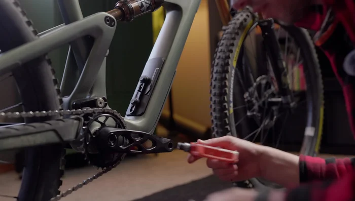Thread the pedal onto the crank, turning the wrench towards the front of the bike to tighten. Don't overtighten.