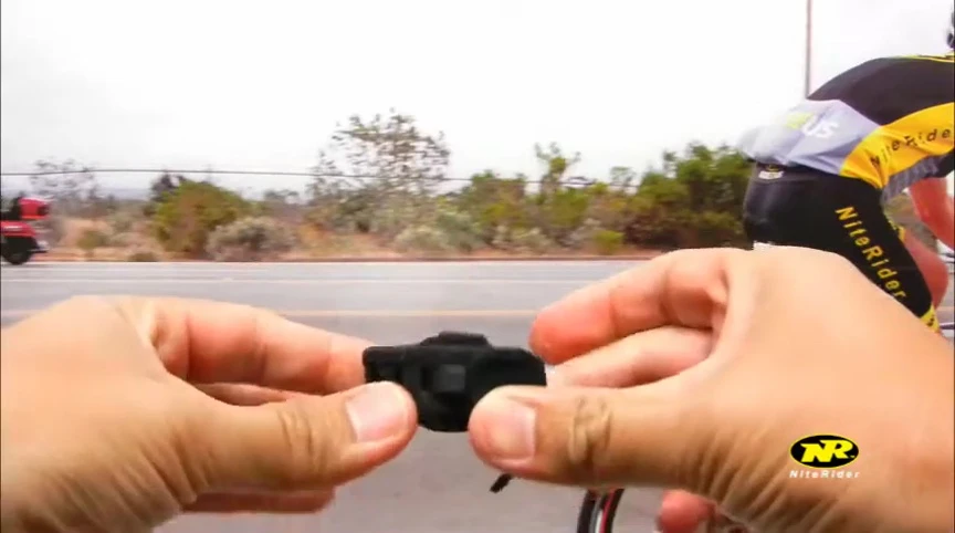 Demonstrating the easy attachment of the light to the mount.