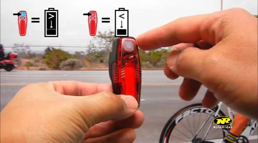 Close-up of the Sabre35 power button showing the red battery indicator light.