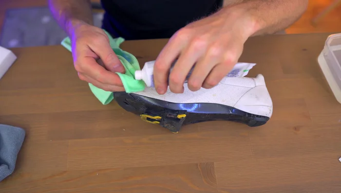 Apply a small amount of whitening toothpaste to a dirty area.