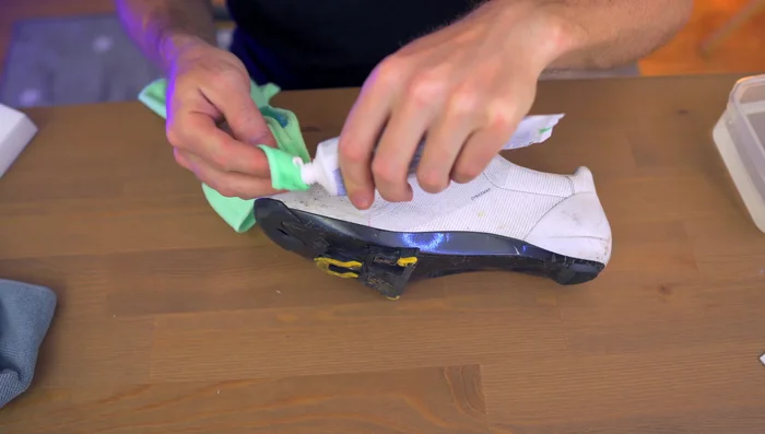 Gently rub the toothpaste into the shoe's surface.