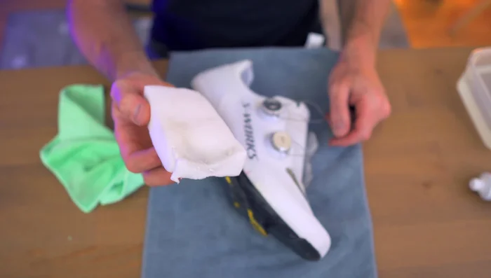 Apply whitening toothpaste to a damp magic eraser.