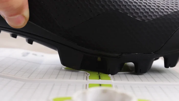 Check both shoes in the tool to ensure cleat positions match, using the center line to align shoes.