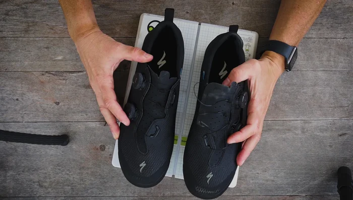 Check both shoes in the tool to ensure cleat positions match, using the center line to align shoes.