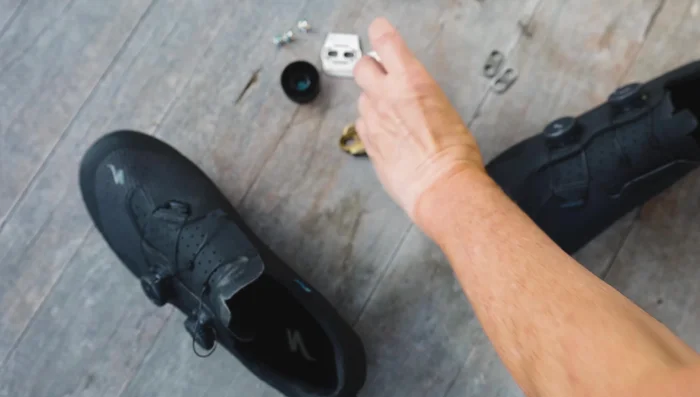Install shoe shields or shims and cleats to the shoe, but don't tighten them yet.