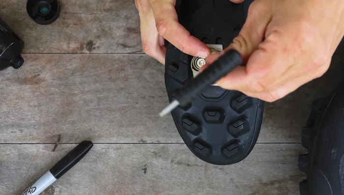 Install shoe shields or shims and cleats to the shoe, but don't tighten them yet.
