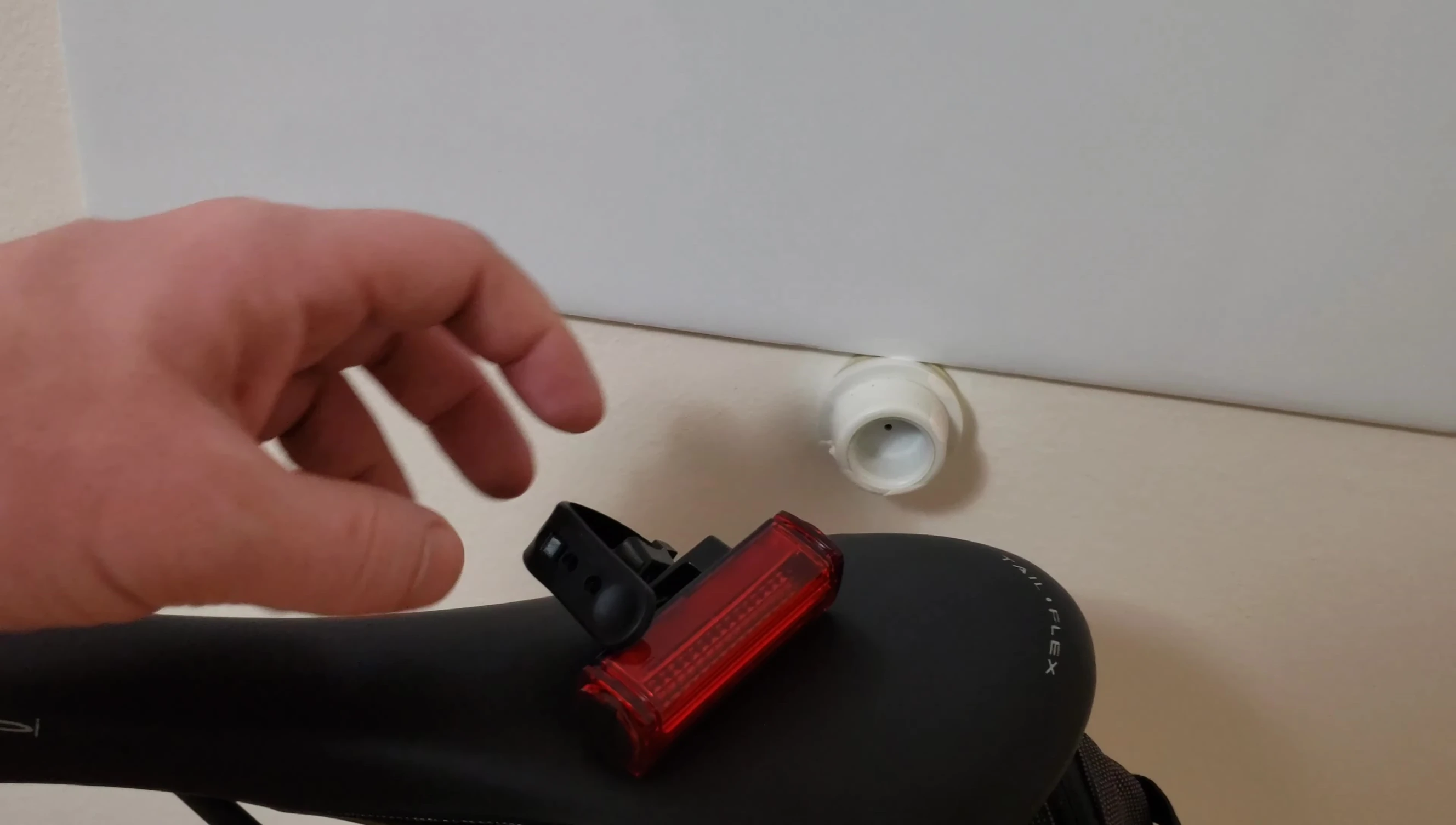 Close-up of the bike light's strap and how it attaches to the seatpost.