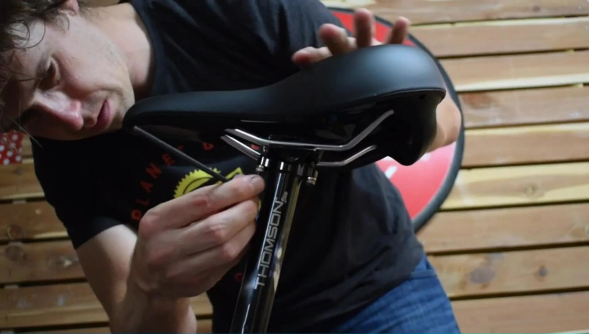 Close-up showcasing the material and construction of the Planet Bike saddle.
