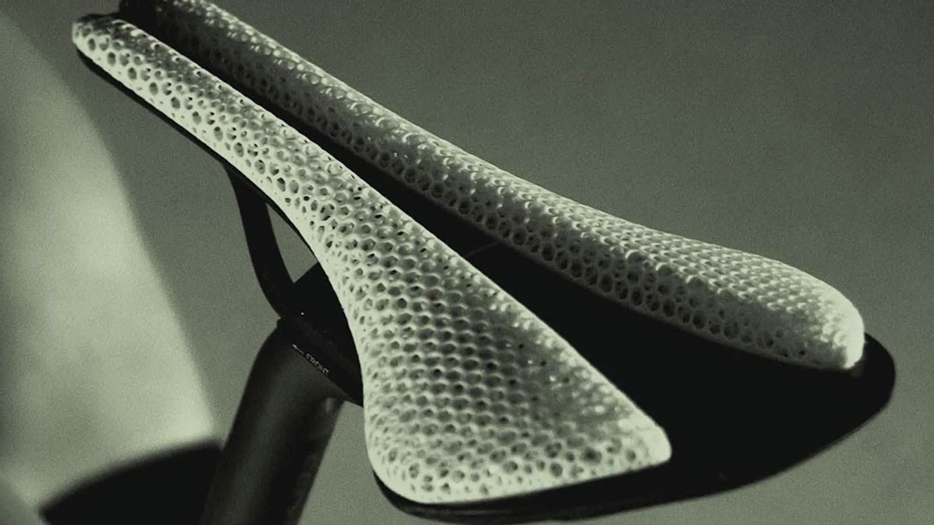Close-up of the Fizik Adaptive 00 saddle showcasing its unique 3D-printed design.