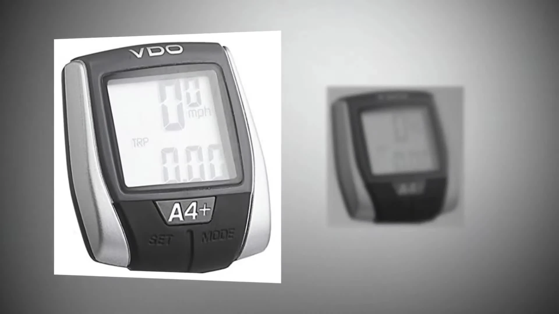 Close-up of the VDO A4+ cycle computer displaying speed and mileage
