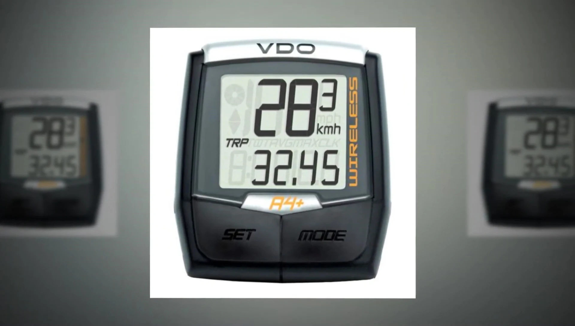 Hand interacting with the VDO A4+ buttons while riding