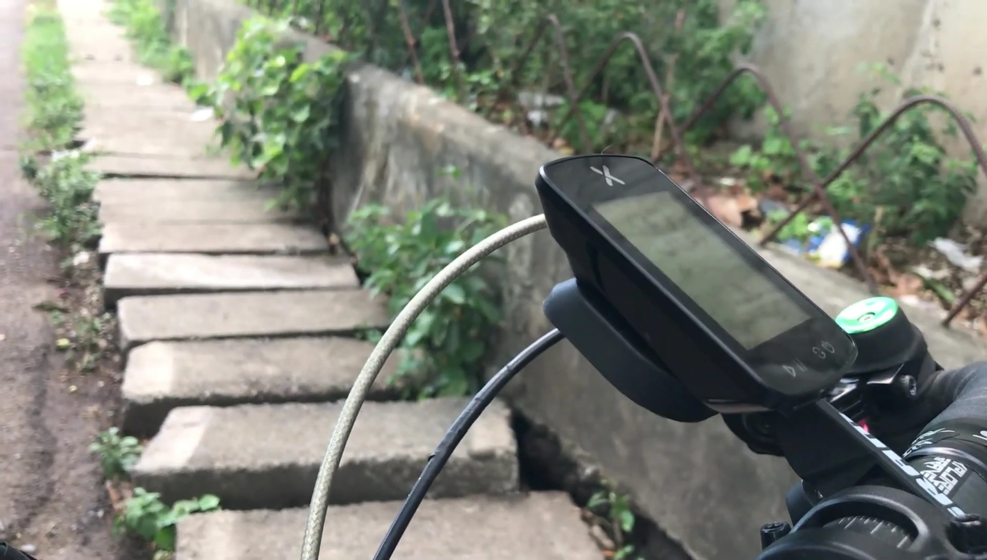 Close-up of the XOSS G2+ showing its trapezoidal shape