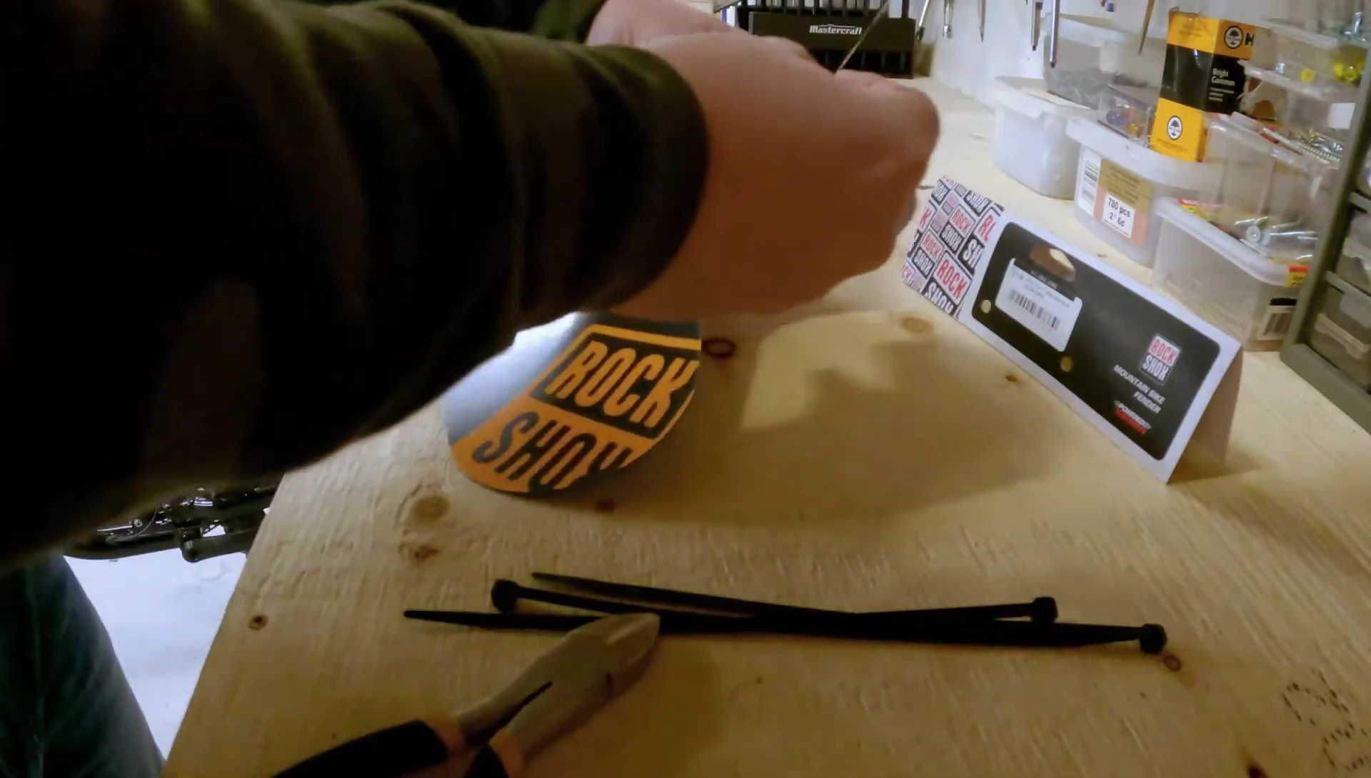Running the zip ties underneath the fork.
