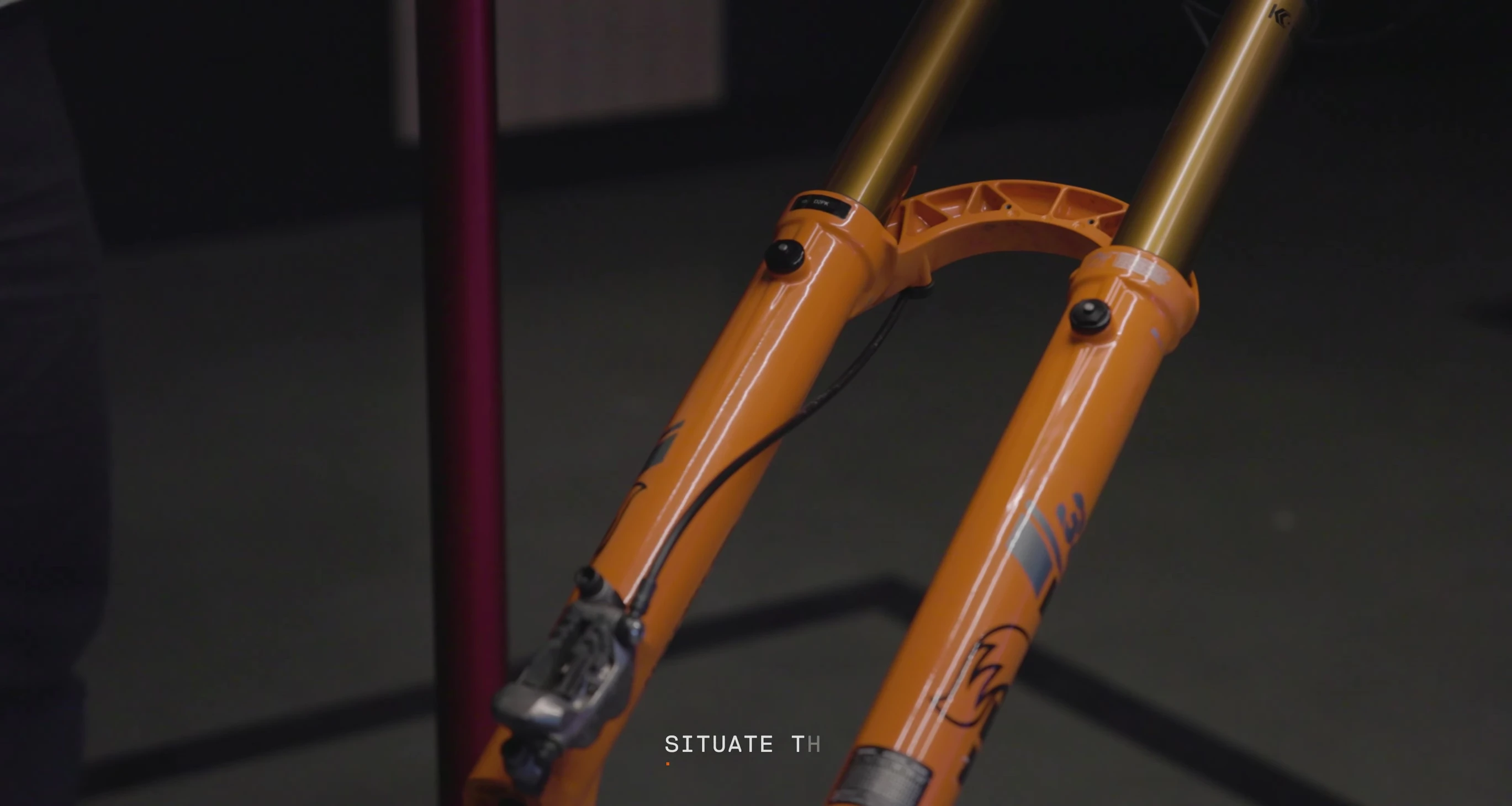 Releasing air pressure from the fork's pressure release buttons.