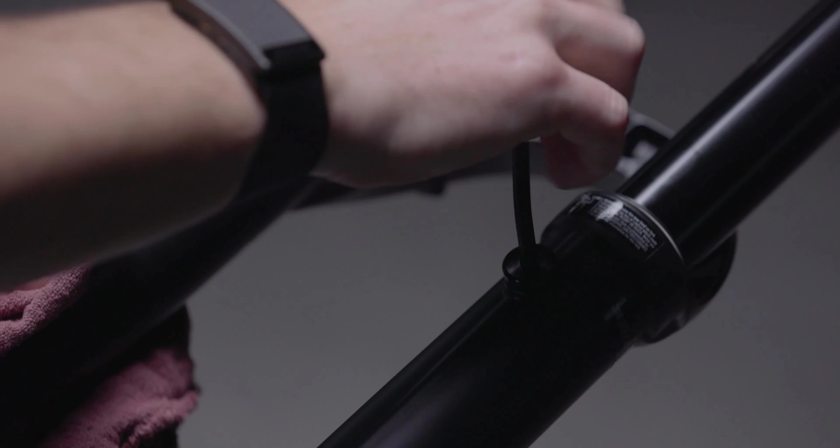 Using a 5mm hex wrench to remove the pressure release plug.