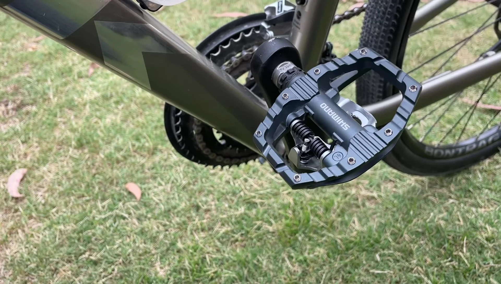 The pedals being used in a cycling situation, emphasizing lightweight feel.