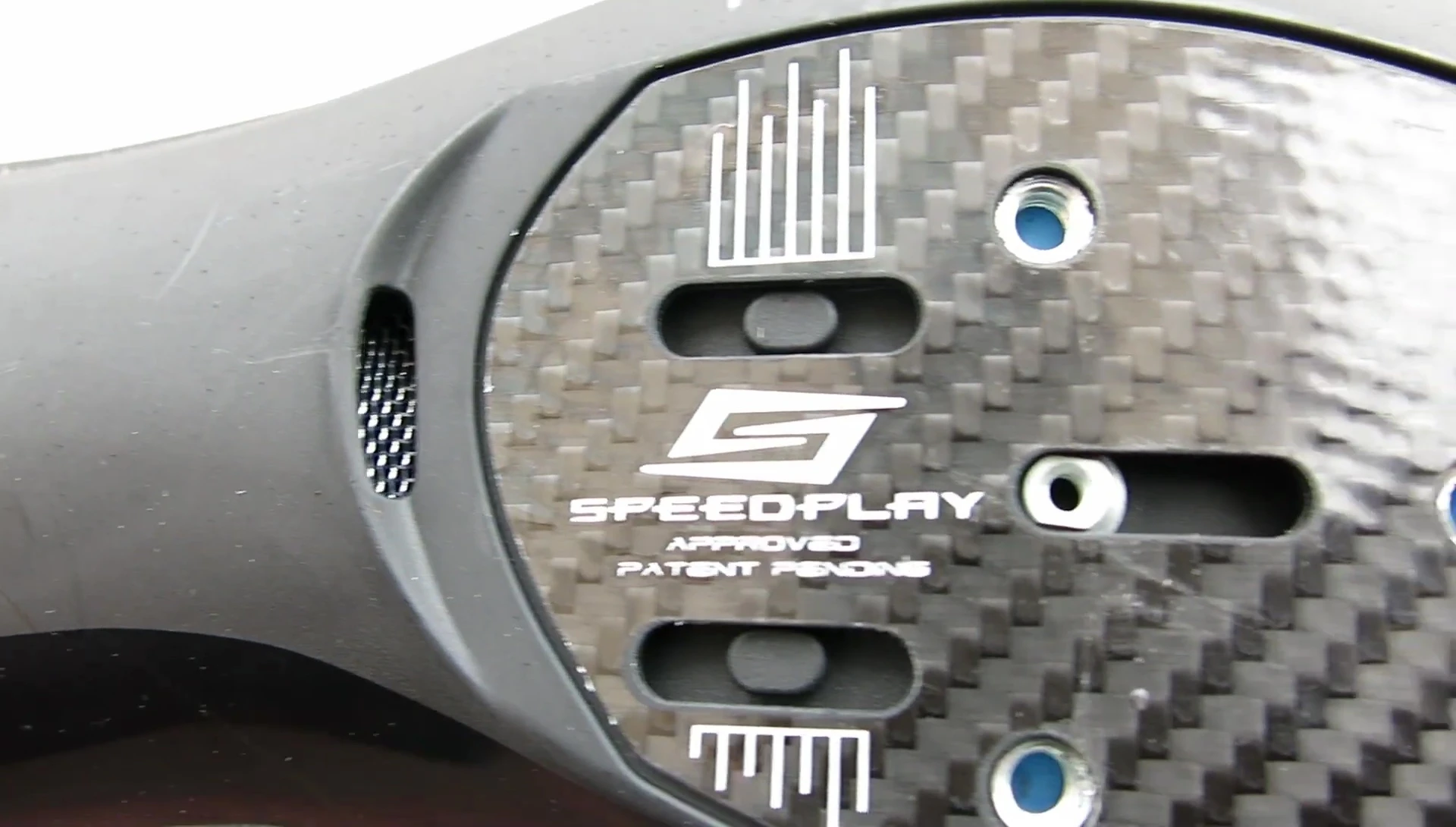 Bottom of the shoe showcasing the carbon and fiberglass sole.