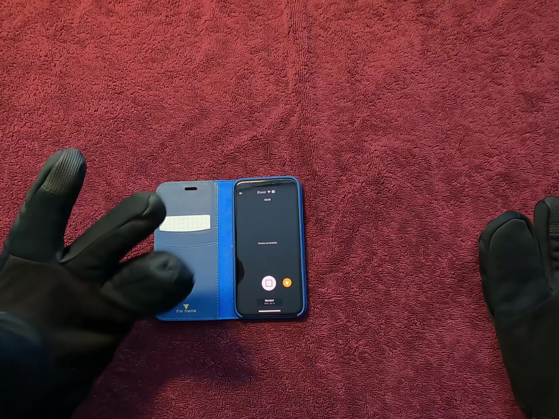 The reviewer demonstrating the Wiretap technology with their iPhone.