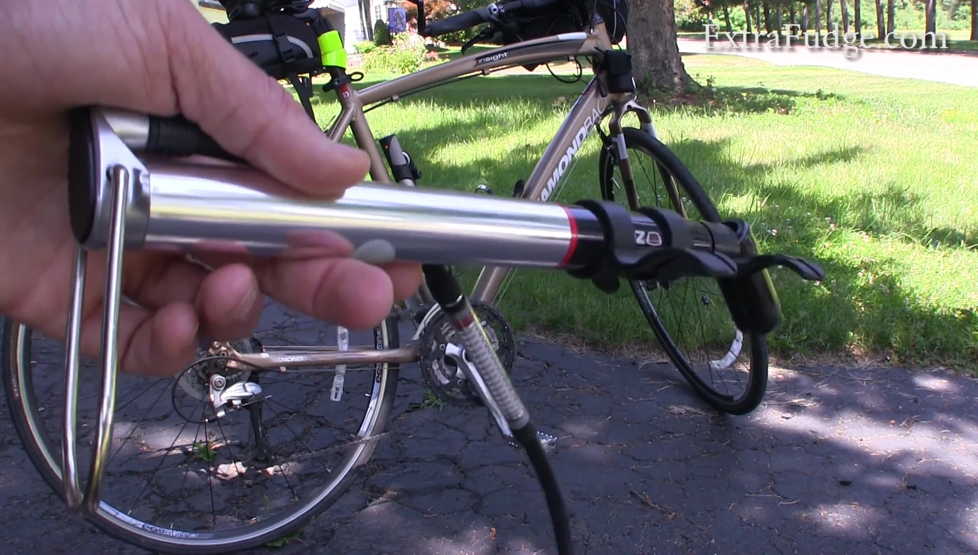 The reviewer demonstrating the difficulty in pumping the Zefal pump.