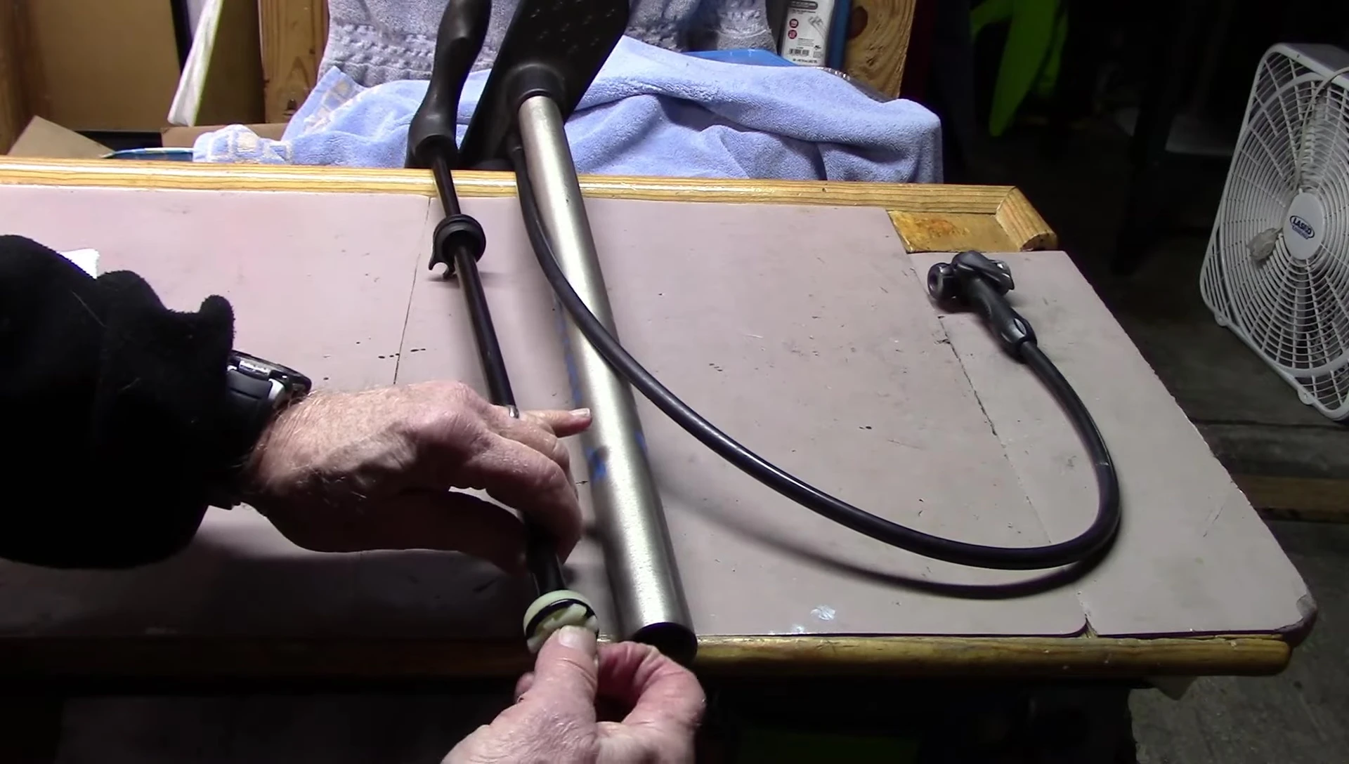 Removing the O-ring from the bicycle pump piston.