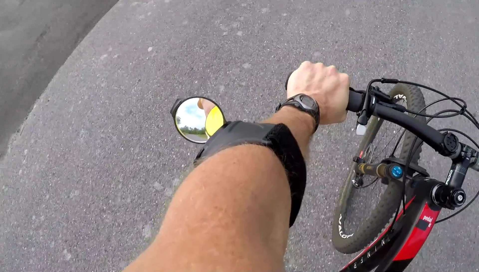 The mirror on the user's arm while riding