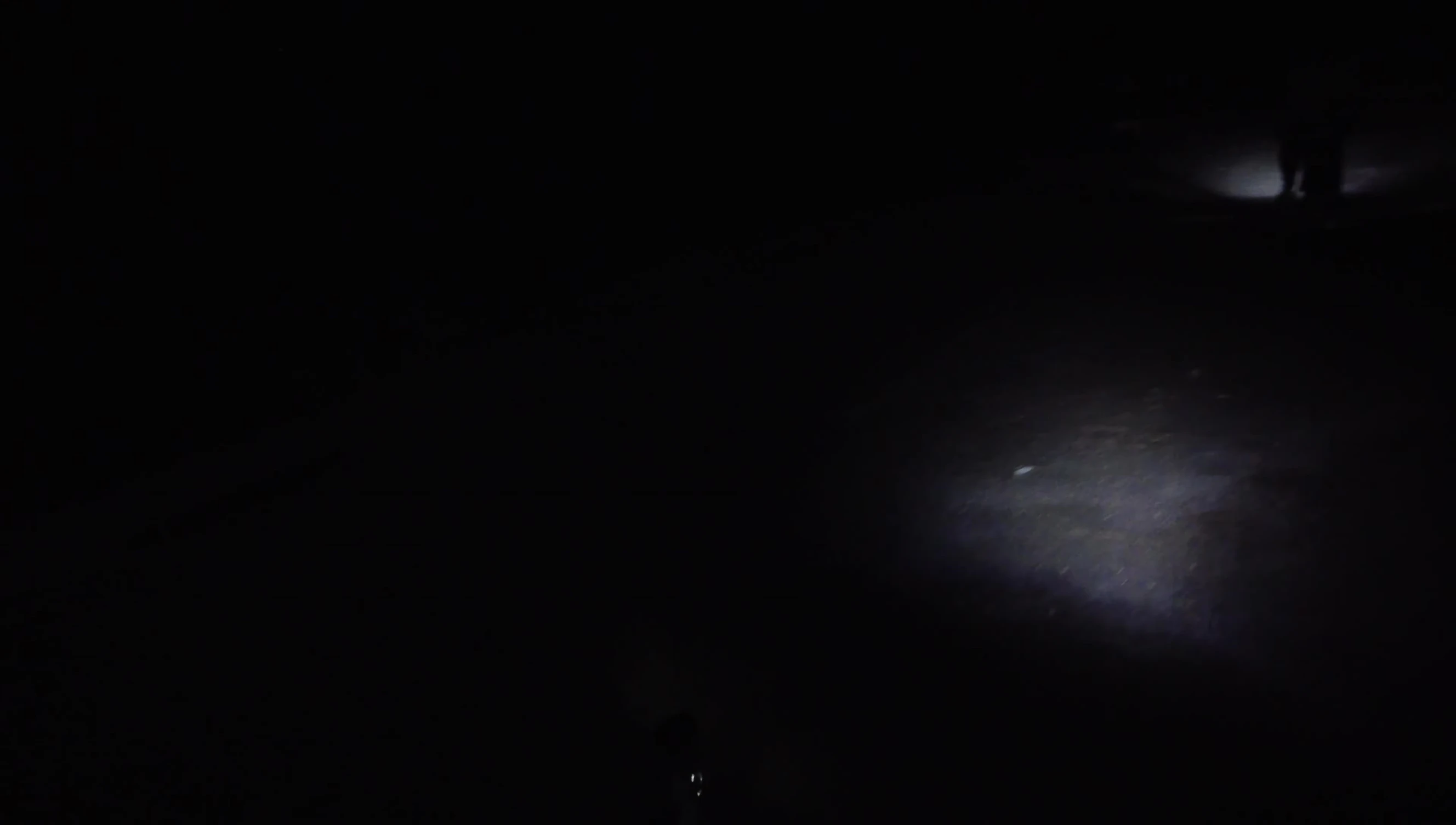 The cyclist testing the light at night.