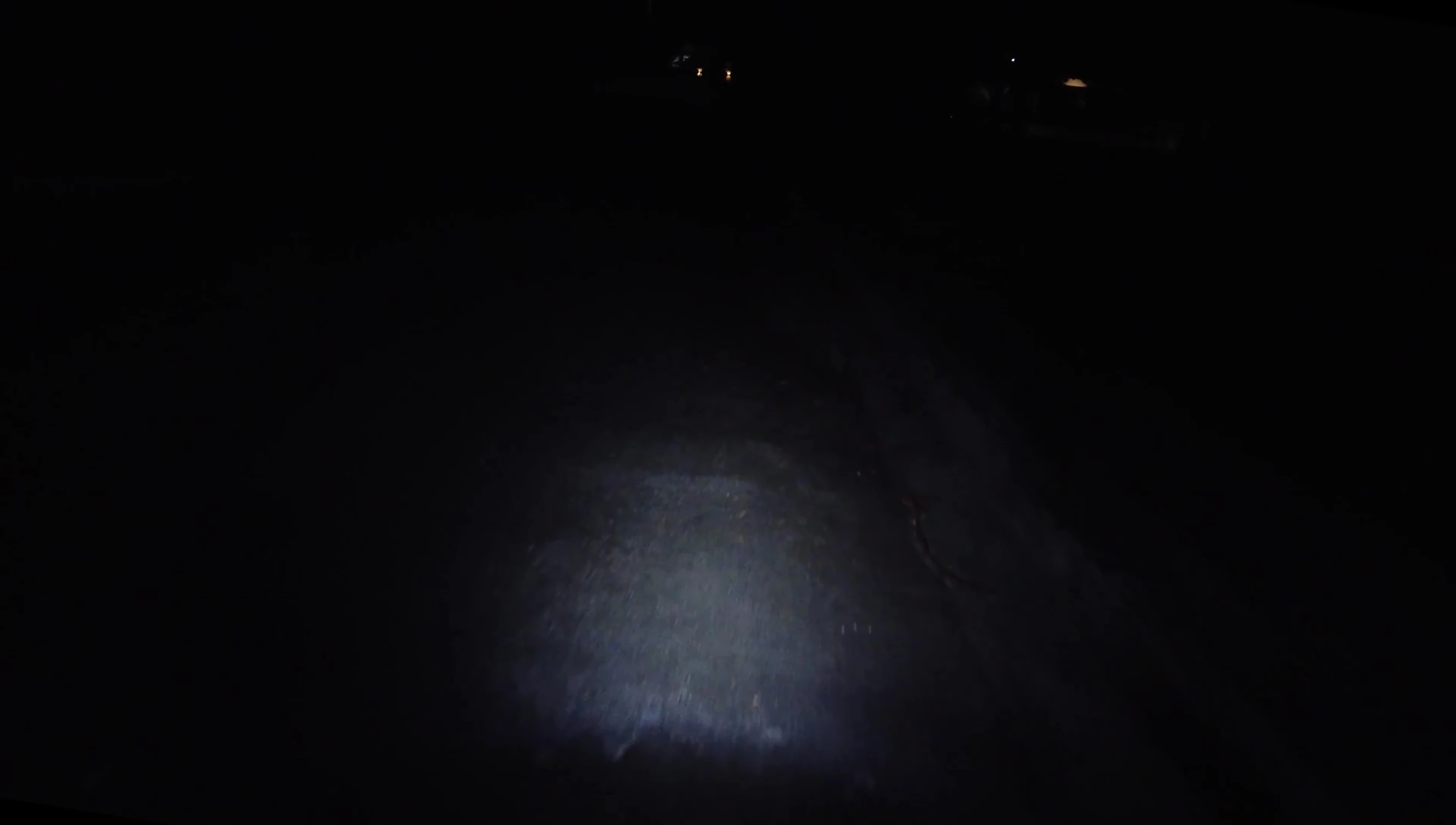 The cyclist using the light in a dark area.