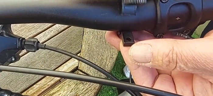 Tighten the screws to secure the headlight to the mount.