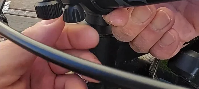 Tighten the screws to secure the headlight to the mount.