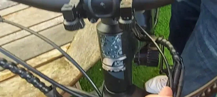 Once the alignment is satisfactory, firmly tighten the clamps to secure the headlight.