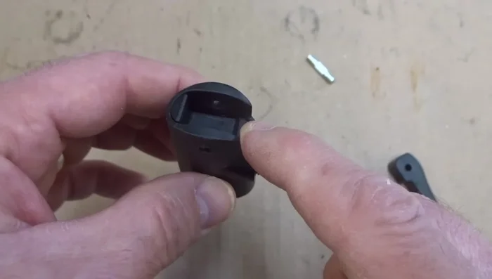 Pull off the lever and push out the internal parts (plastic parts, ball, gaskets) using a punch.