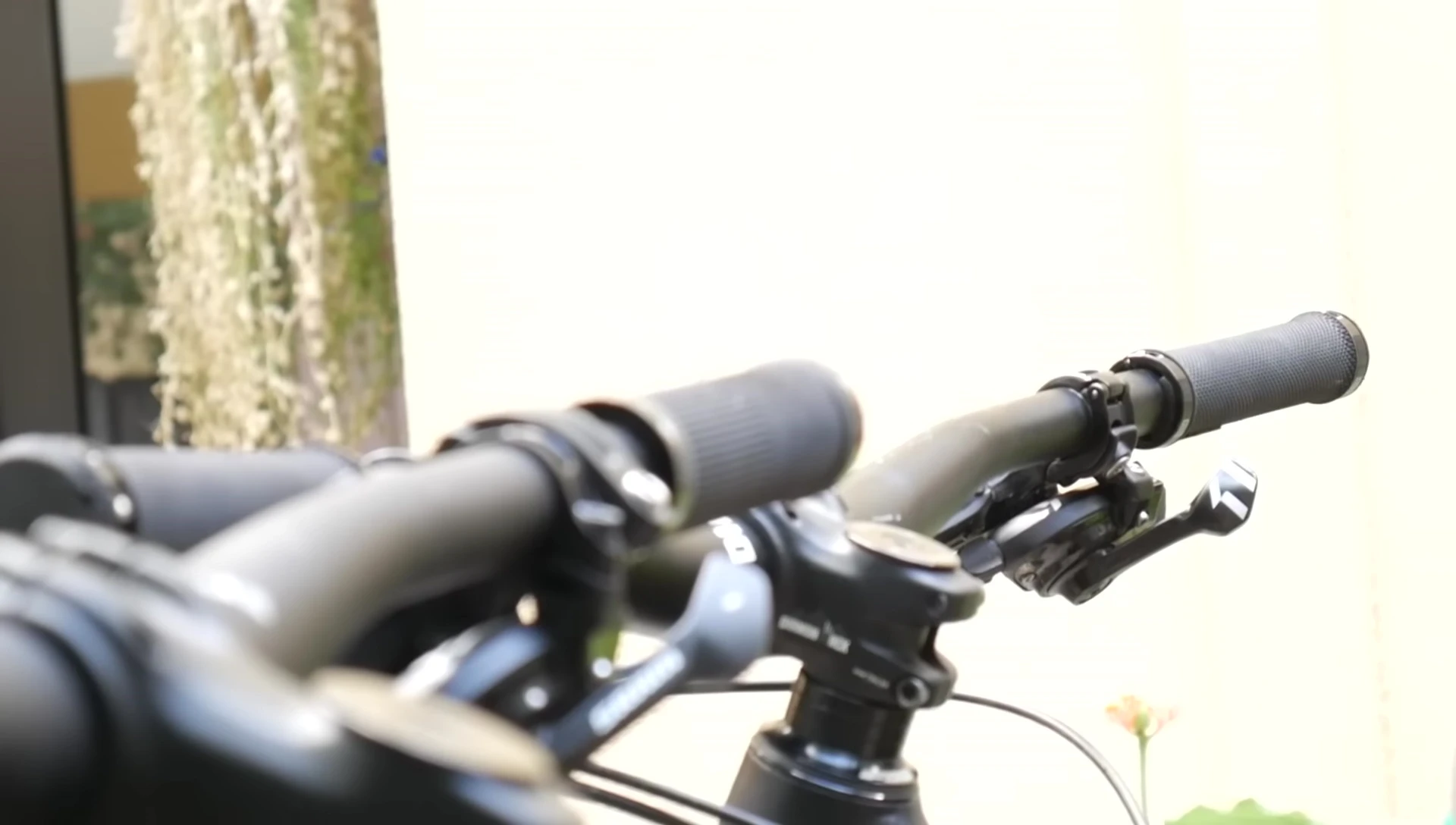 Close-up of lock-on grips showing screw mechanism.