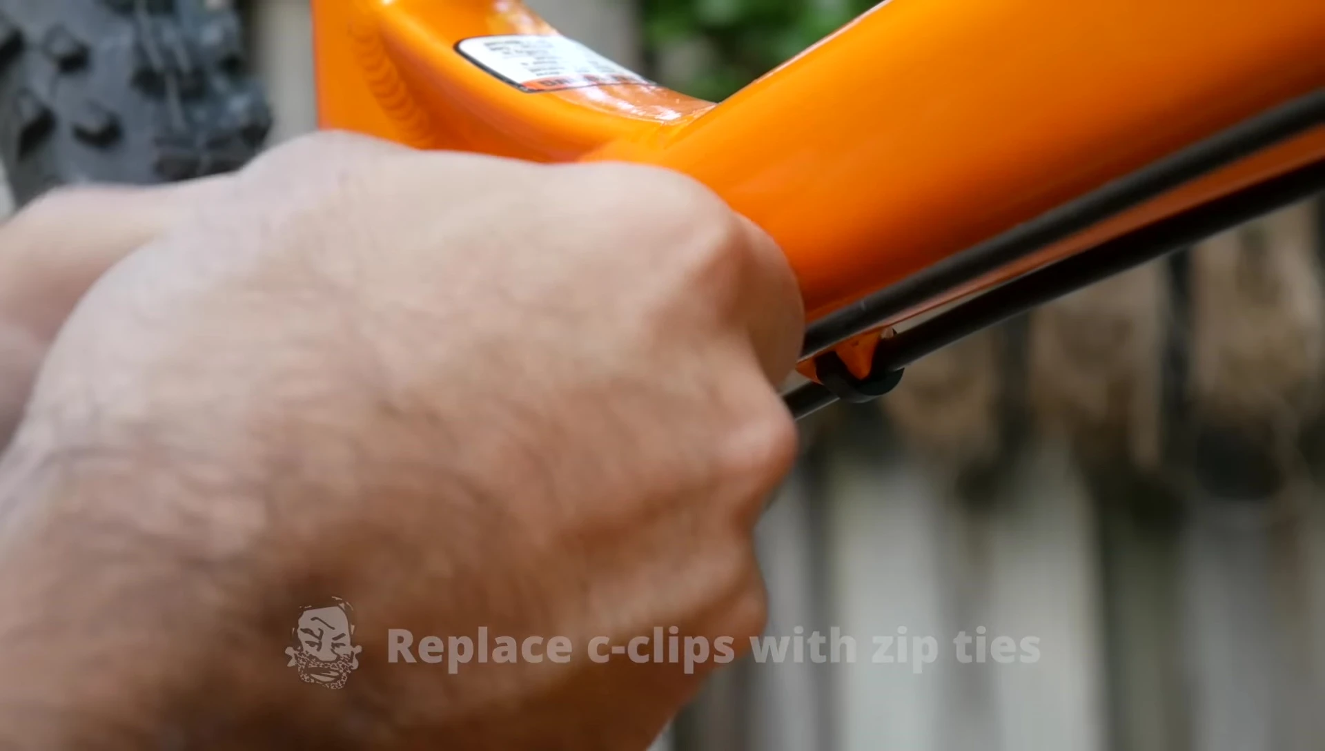 Multicolored zip ties neatly securing bike cables.
