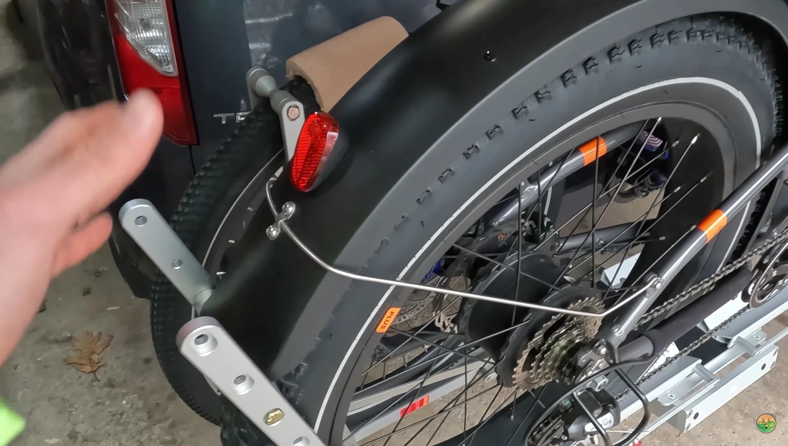 Showing the OneUp's wheel holders and its compatibility challenges.