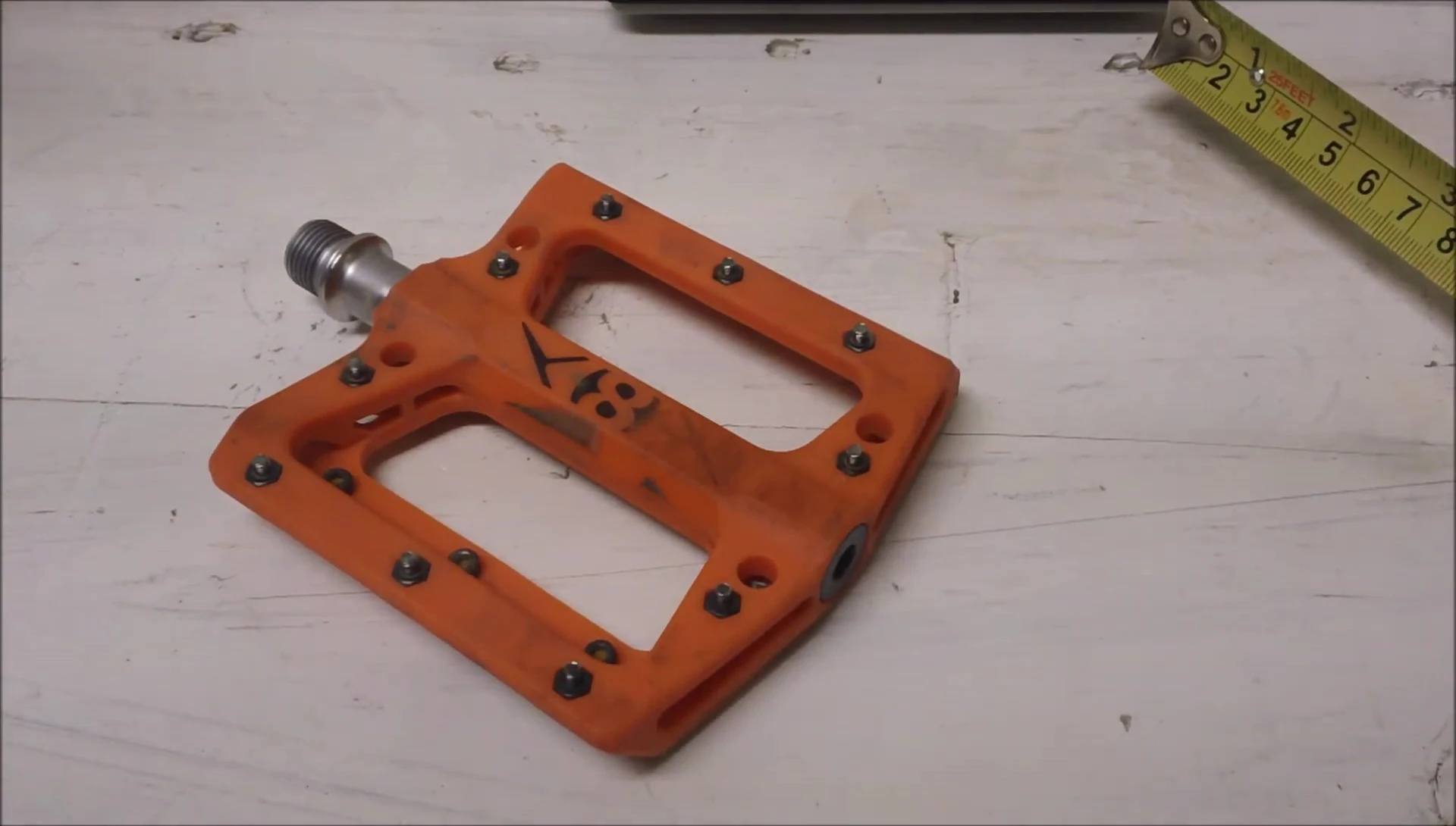 The speaker showing the pedals mounted on the bike