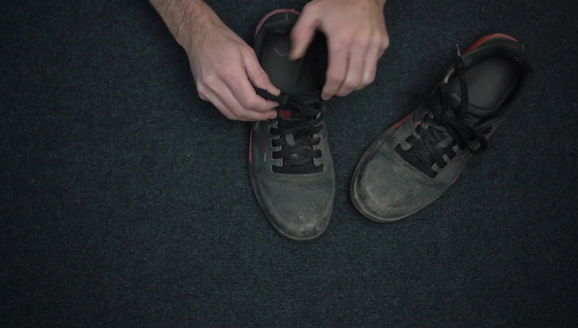 A shot illustrating the lack of a lace-tucking mechanism on the shoes.