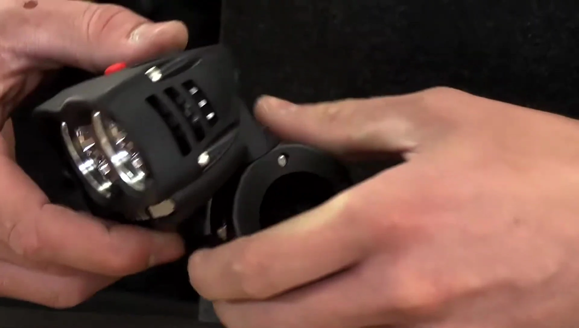 Close-up of the two light units and bar clamps in the packaging