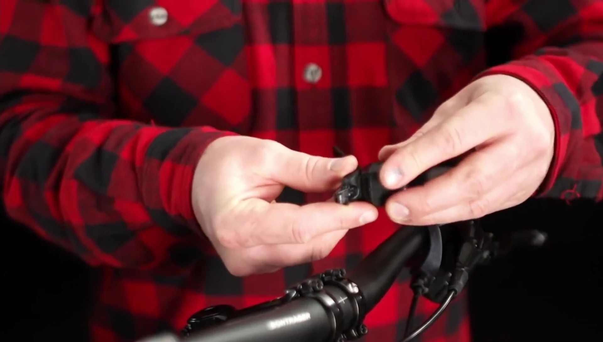 Attaching the quick connect bracket to the handlebars.