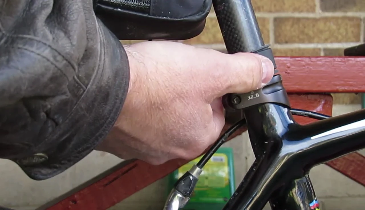 Close-up showing the rubber shim protecting the bike's seat post.
