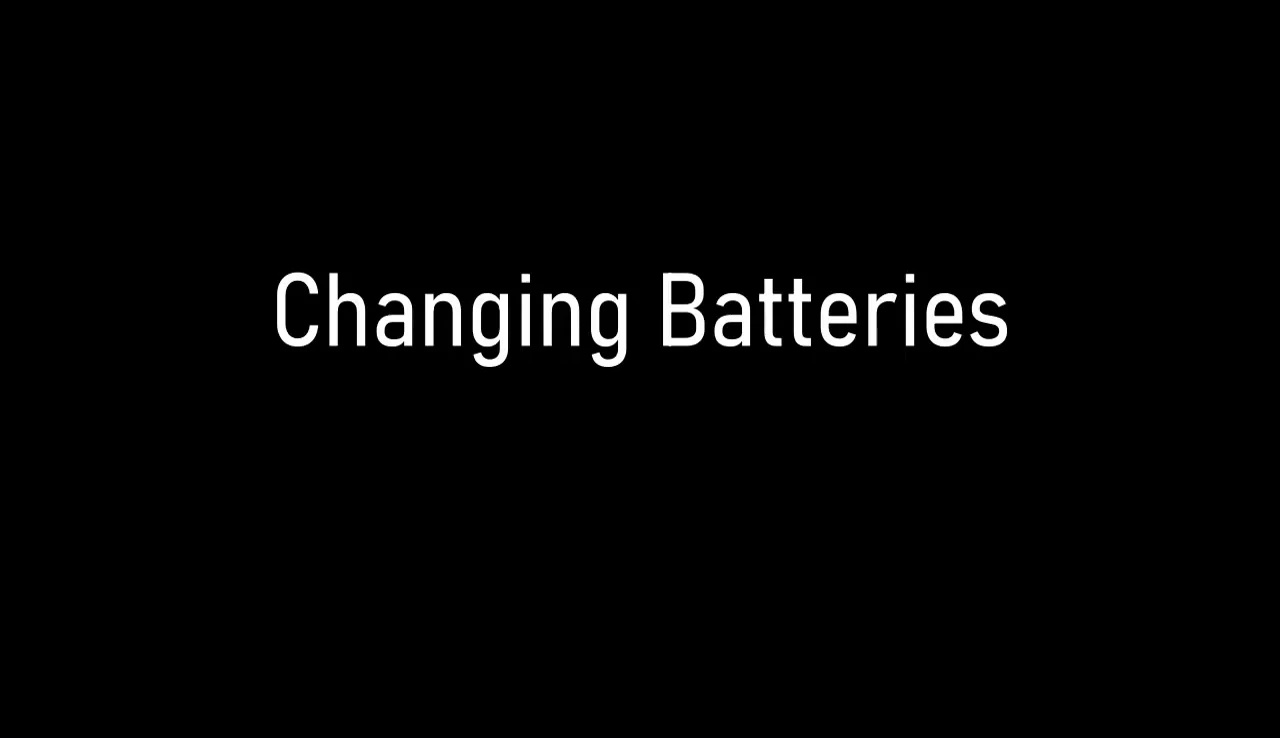 Demonstrating the easy battery replacement process.