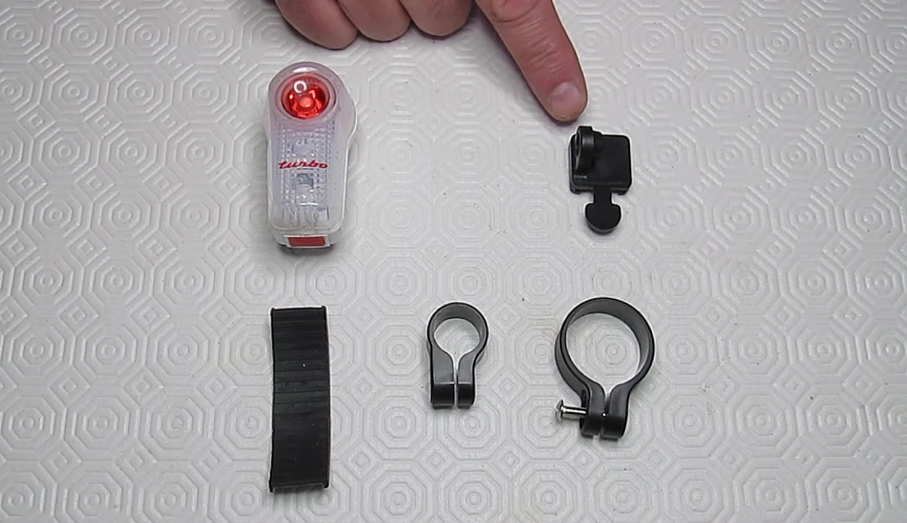 Unboxing the Planet Bike Superflash Turbo, showing the light, brackets, and rubber shim.