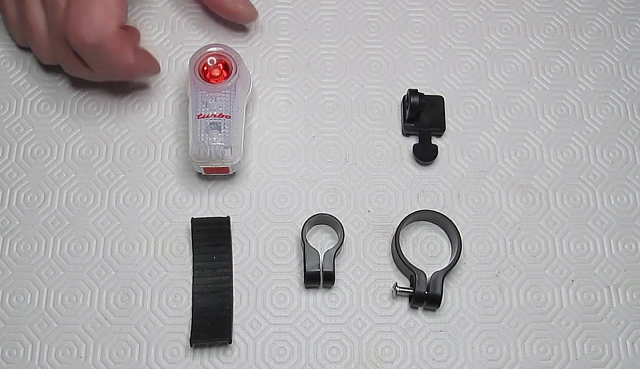 Close-up of the Superflash Turbo light showing the bright LED and clear plastic casing.