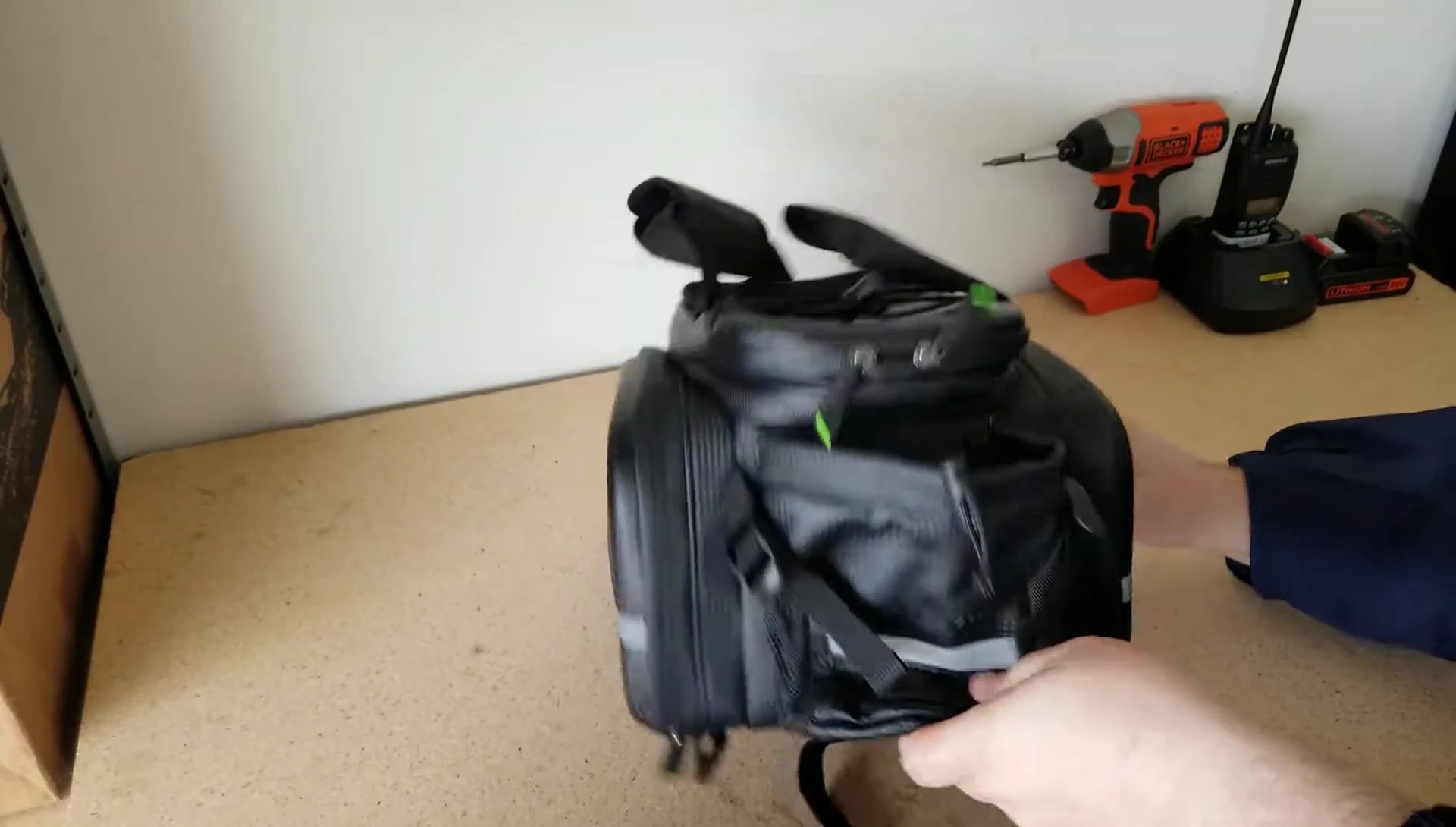 Opening the bag to show the internal space