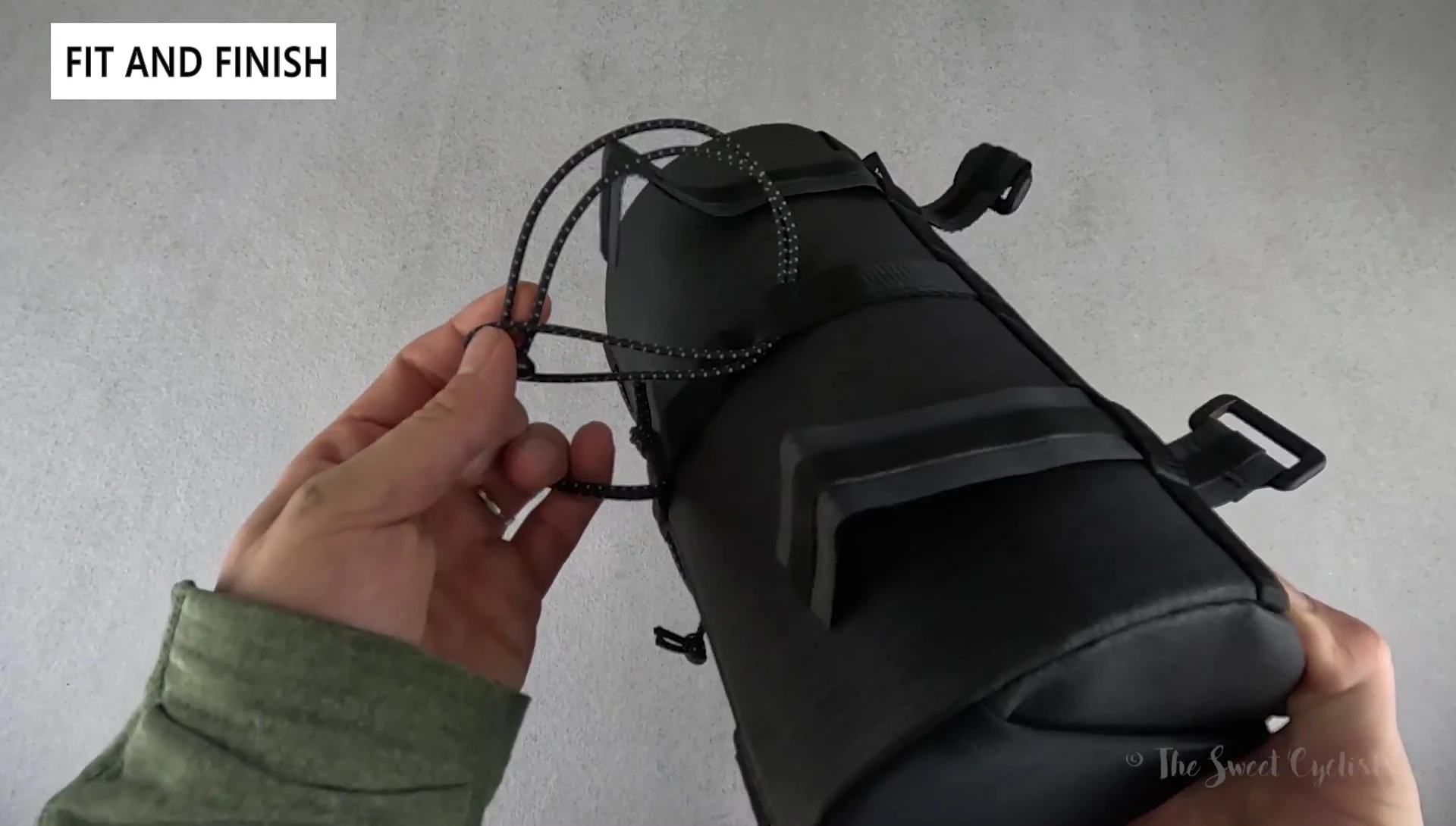 Close-up showcasing the secondary bungee cord on the bag's rear.