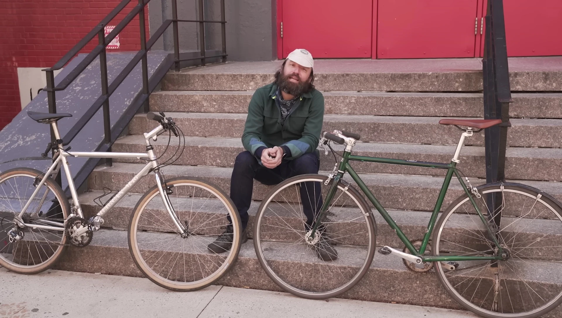 A person pointing out the thin walled aluminum tubing on a bicycle frame.